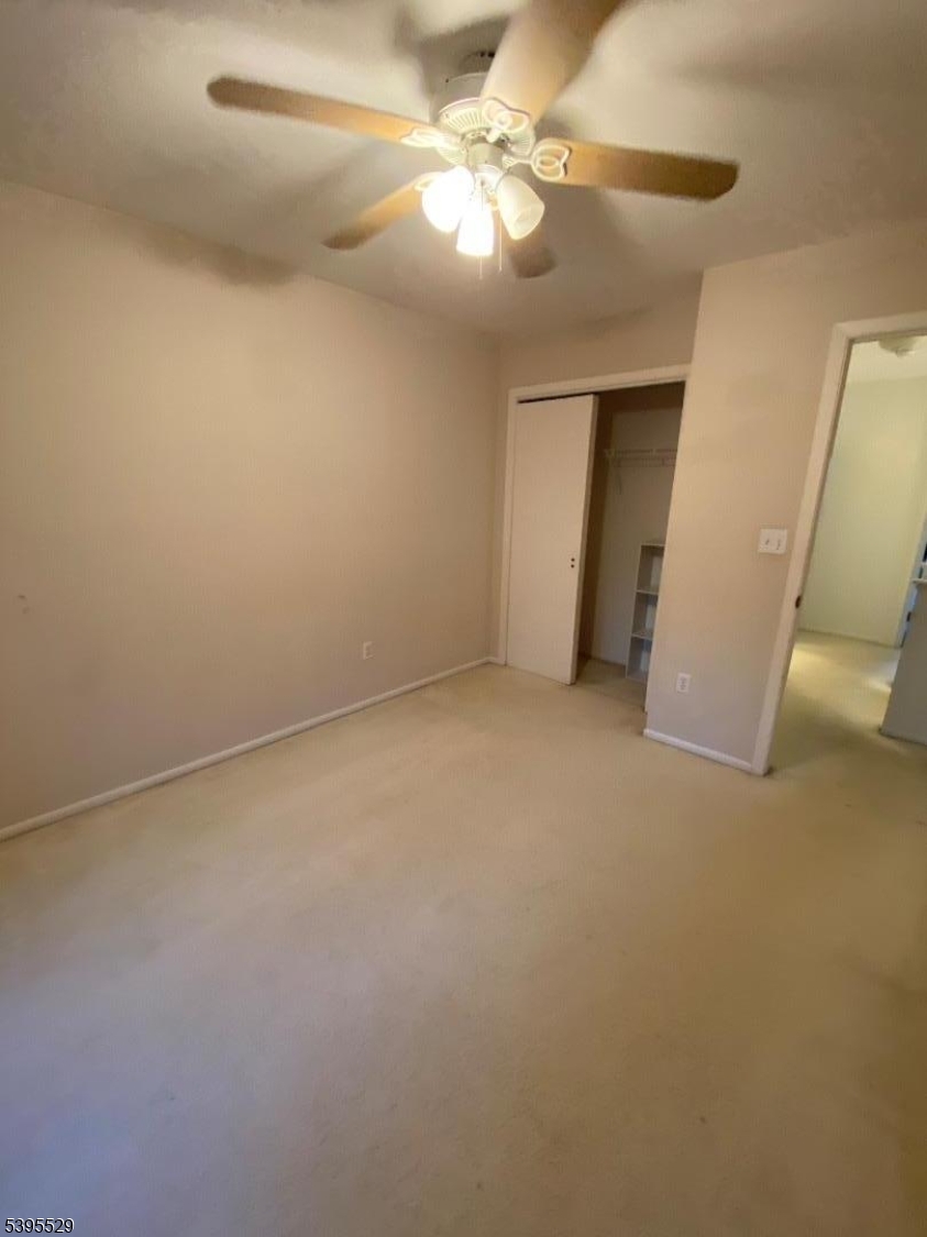 16 Mountain View Court Hamburg, NJ 07419 - Photo 12 of 21 en empty room with windows and fan