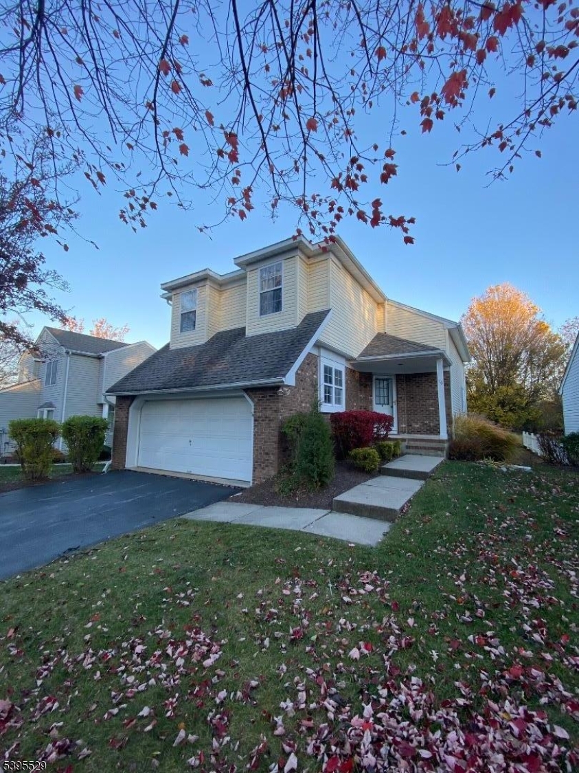 16 Mountain View Court Hamburg, NJ 07419 - Photo 21 of 21 a front view of a house with a yard and garage