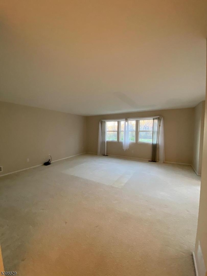 16 Mountain View Court Hamburg, NJ 07419 - Photo 4 of 21 a view of an empty room with a window