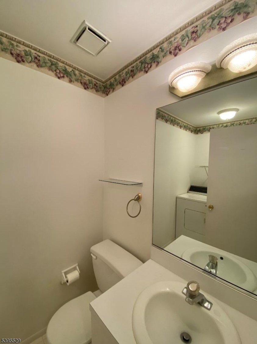 16 Mountain View Court Hamburg, NJ 07419 - Photo 5 of 21 a bathroom with a sink mirror vanity and toilet