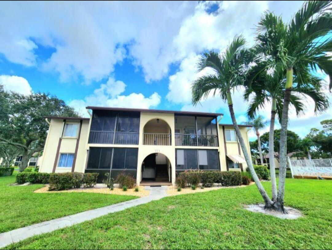 111 Lake Pine Circle, Unit A2 Greenacres, FL 33463 - Photo 1 of 14 a view of house with a yard
