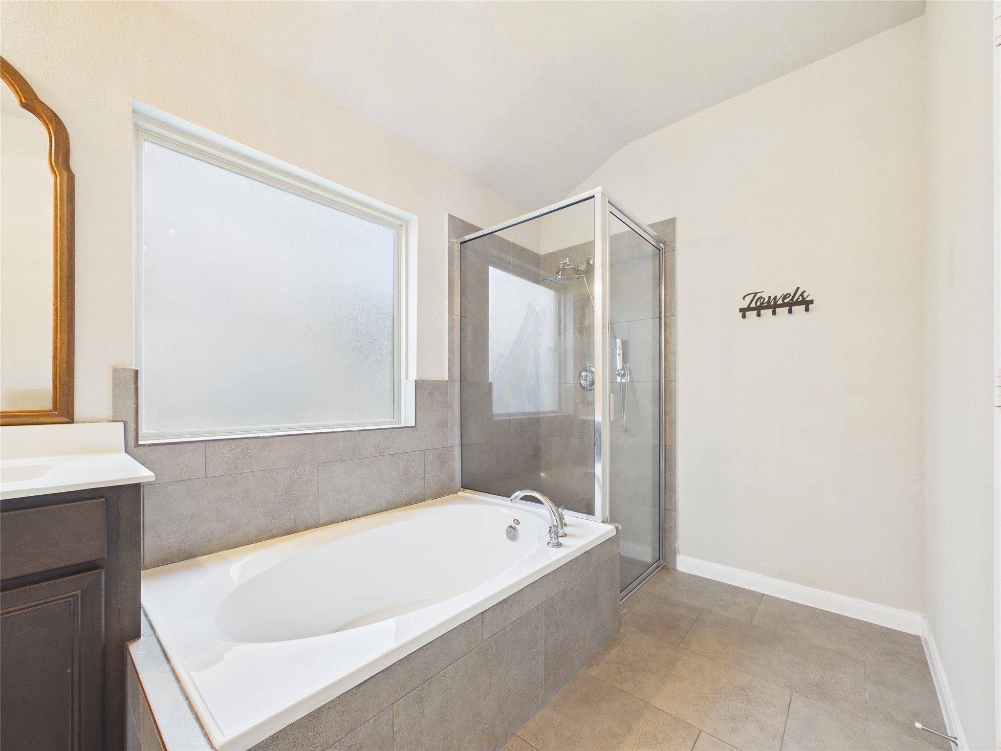 721 Rim Water Drive Alvin, TX 77511 - Photo 22 of 40 a bathroom with a tub shower and sink