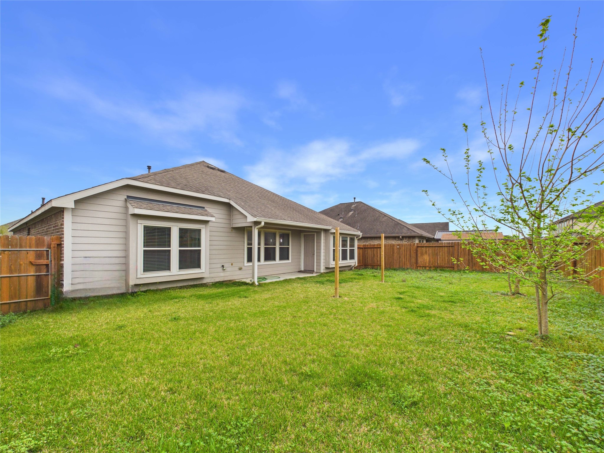 721 Rim Water Drive Alvin, TX 77511 - Photo 32 of 40 a front view of a house with a garden
