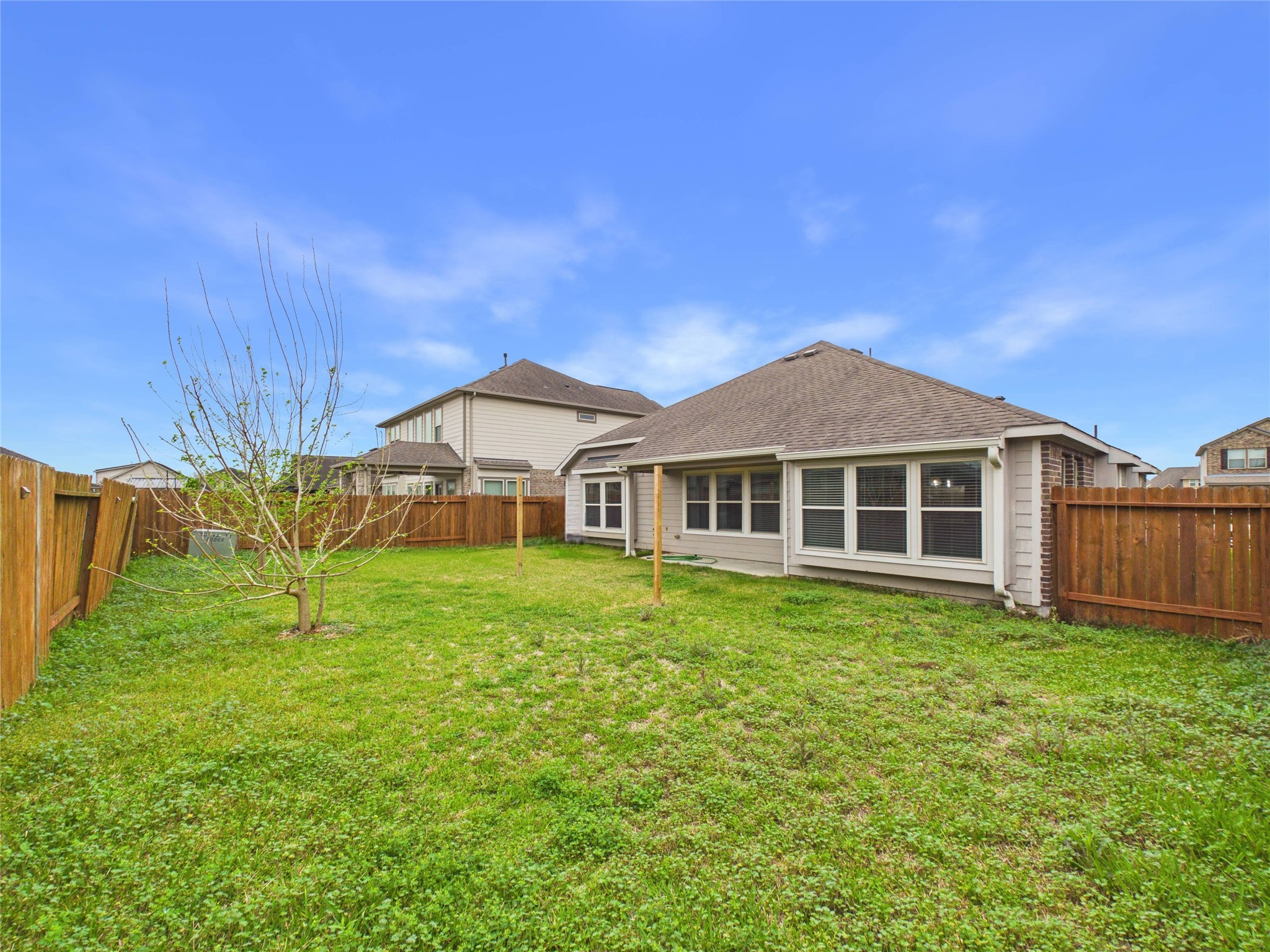 721 Rim Water Drive Alvin, TX 77511 - Photo 35 of 40 a house view with a garden space