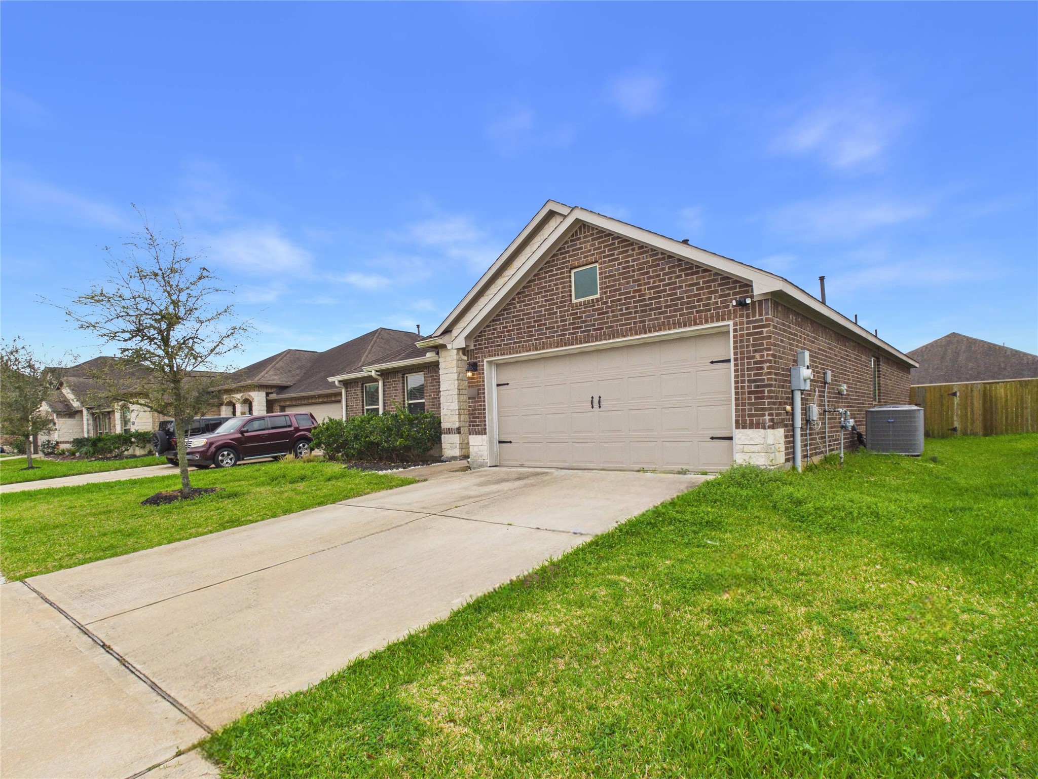 721 Rim Water Drive Alvin, TX 77511 - Photo 38 of 40 a front view of a house with a yard and garage