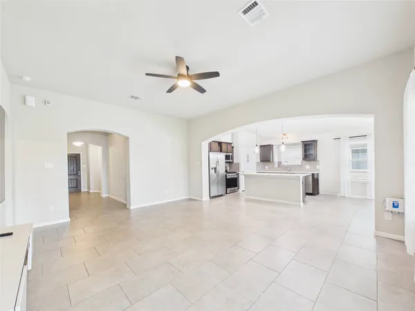 a view of livingroom with hardwood floor and ceiling fan