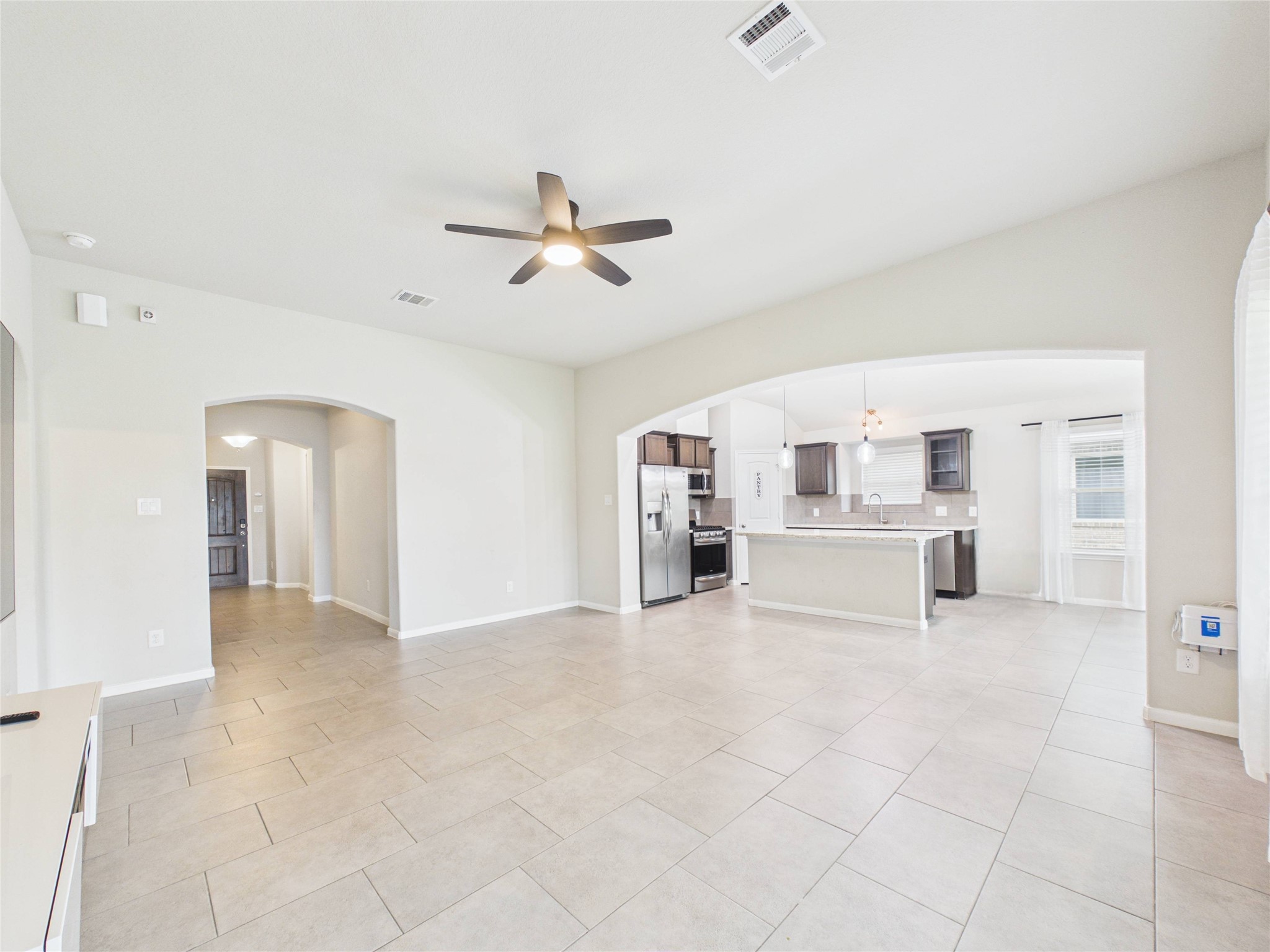 721 Rim Water Drive Alvin, TX 77511 - Photo 6 of 40 a view of livingroom with hardwood floor and ceiling fan