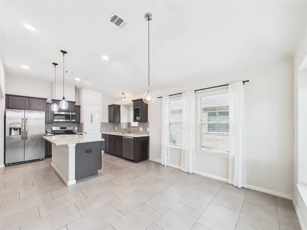 a large kitchen with cabinets