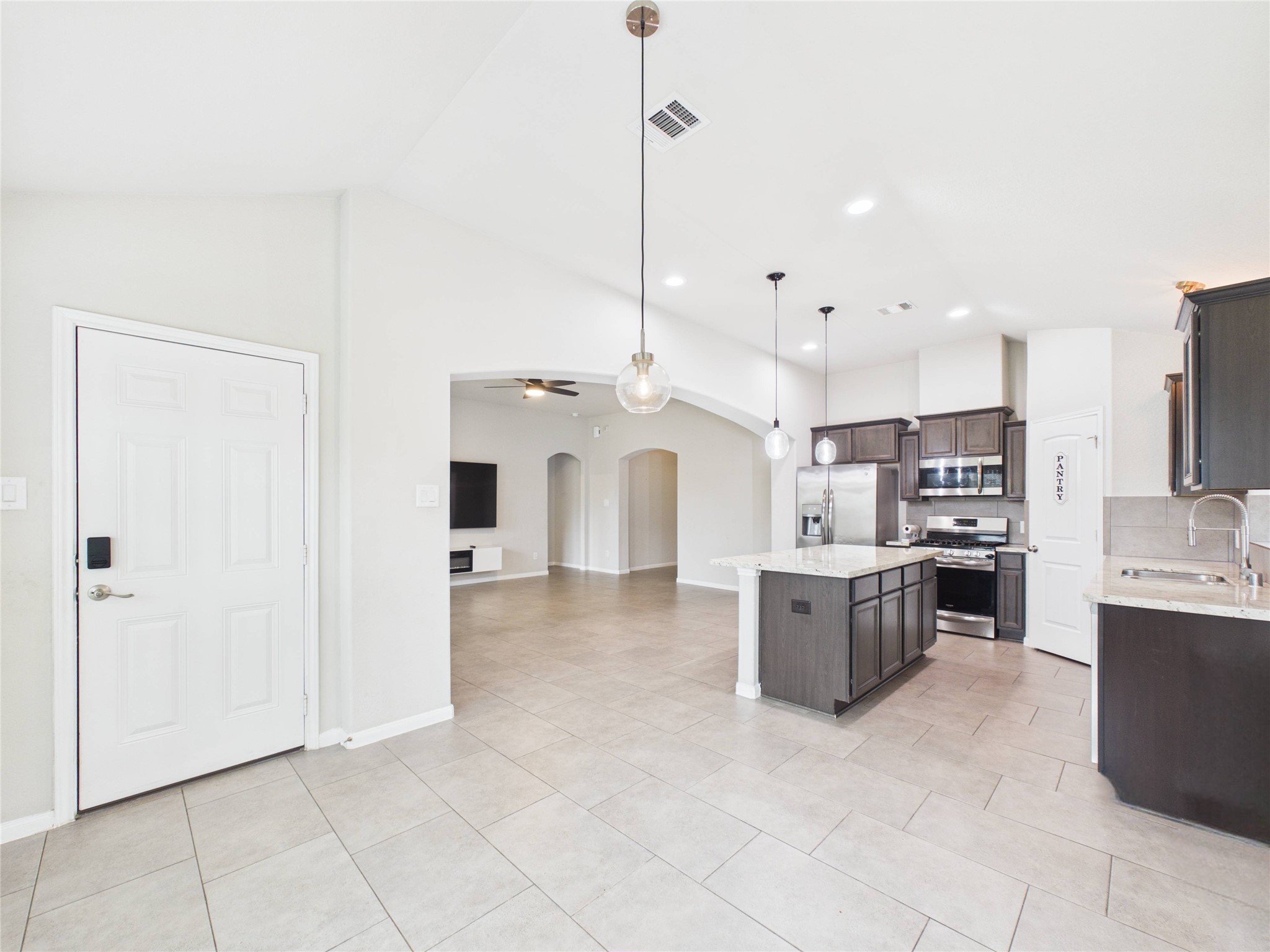 721 Rim Water Drive Alvin, TX 77511 - Photo 8 of 40 a large white kitchen with a large window