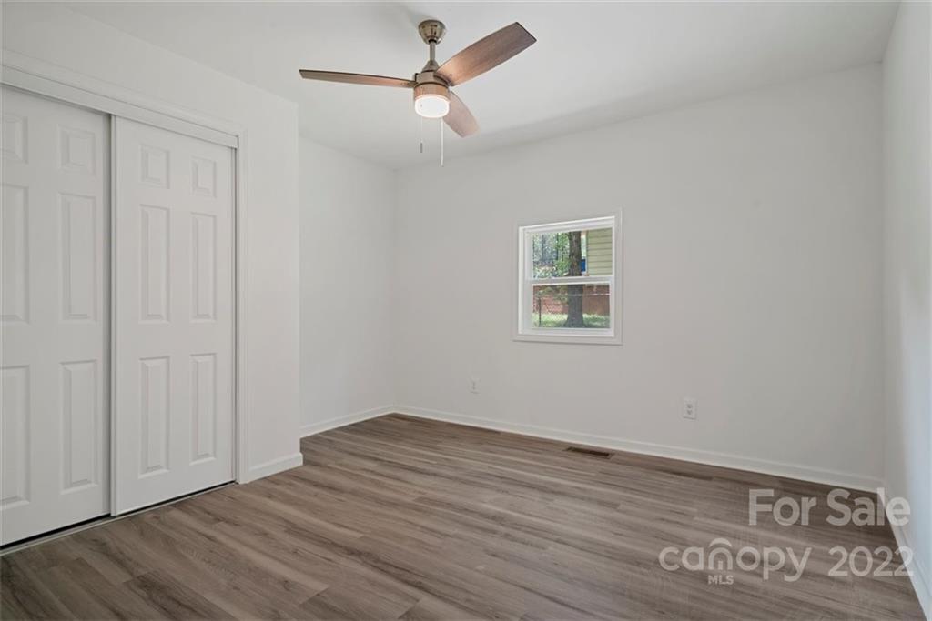 500 3rd Street Stanley, NC 28164 - Photo 12 of 19 a view of room with hardwood floor and ceiling fan