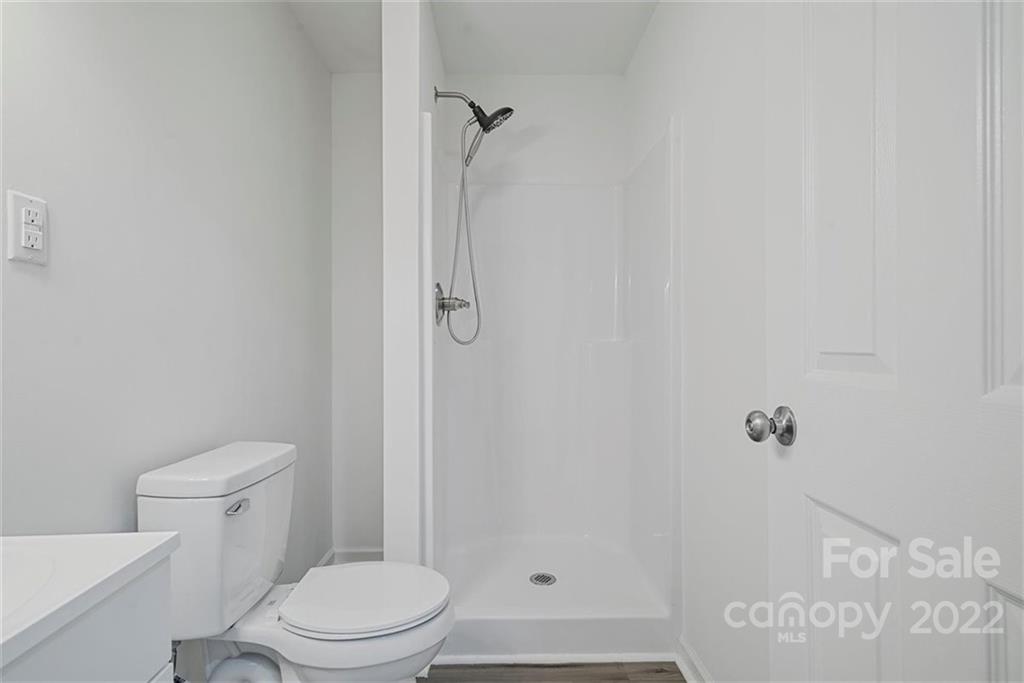 500 3rd Street Stanley, NC 28164 - Photo 14 of 19 a white toilet sitting next to a bath tub