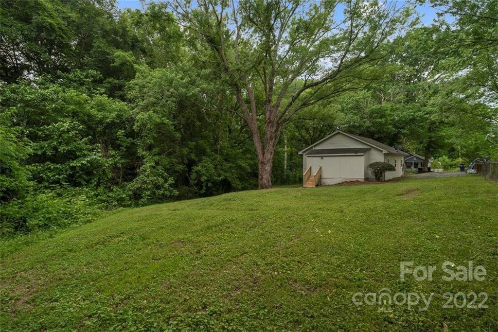 500 3rd Street Stanley, NC 28164 - Photo 19 of 19 a front view of a house with a yard and trees