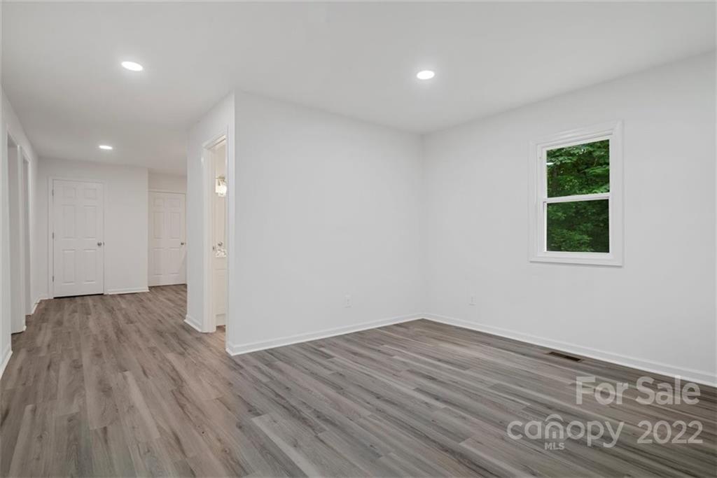 500 3rd Street Stanley, NC 28164 - Photo 6 of 19 a view of a room with wooden floor and a window