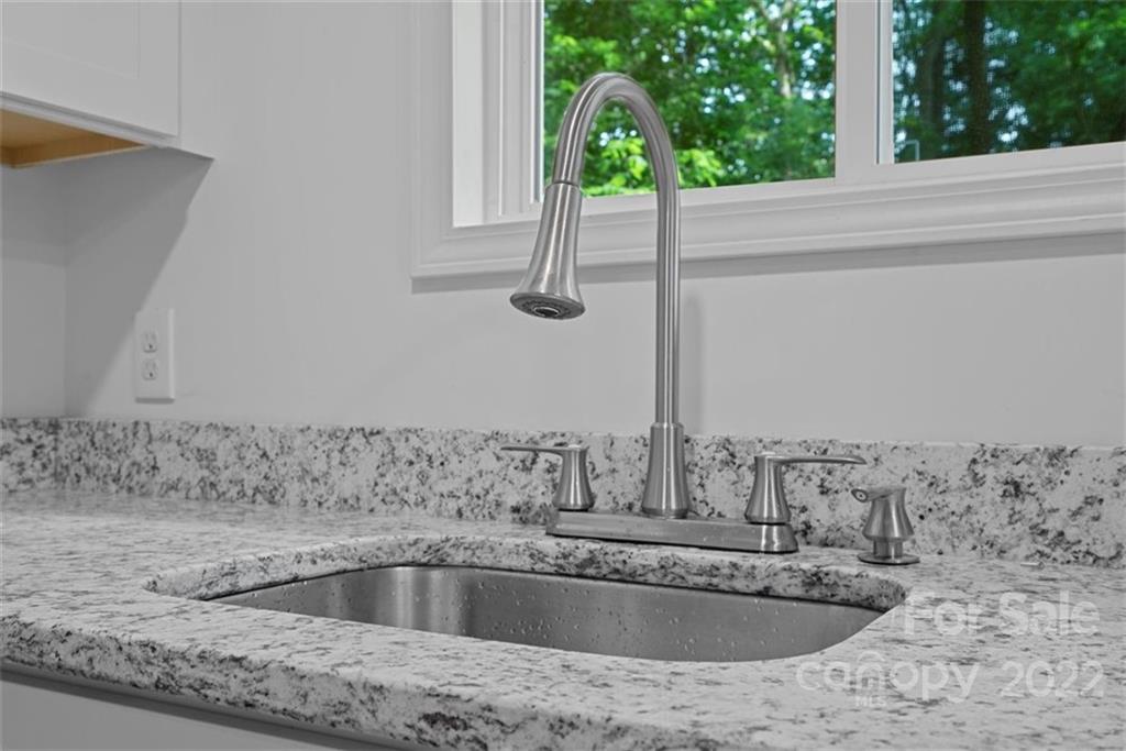 500 3rd Street Stanley, NC 28164 - Photo 9 of 19 a kitchen with a sink and wooden floor