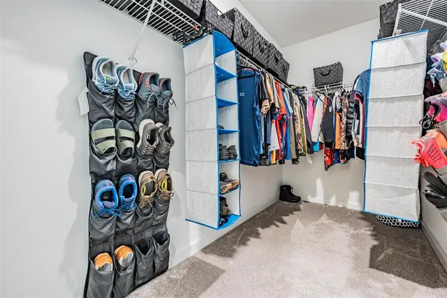 a living room with furniture rug and window