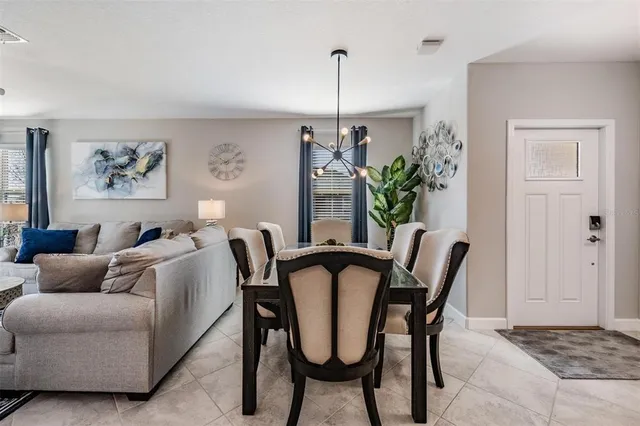 a kitchen with a sink a counter top space appliances and cabinets