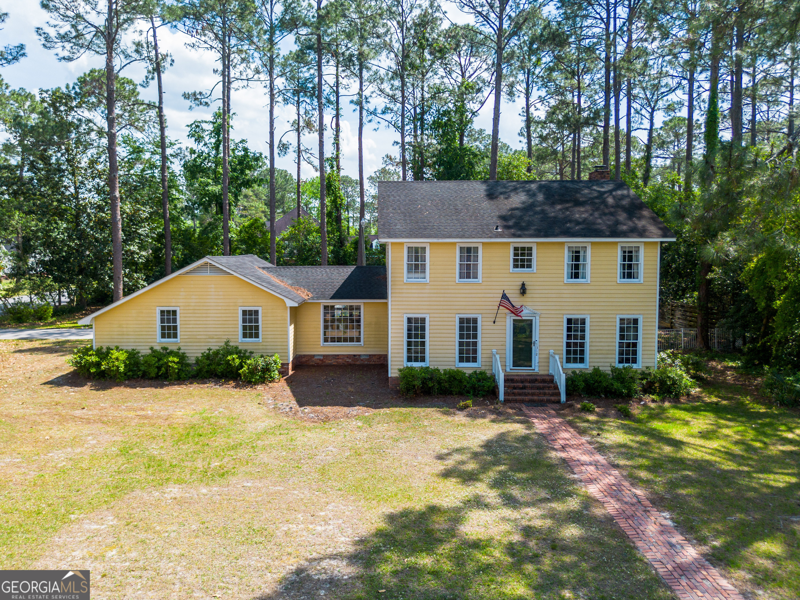 1312 Atlantic Avenue Waycross, GA 31501 - Photo 1 of 34 a front view of house with yard and trees