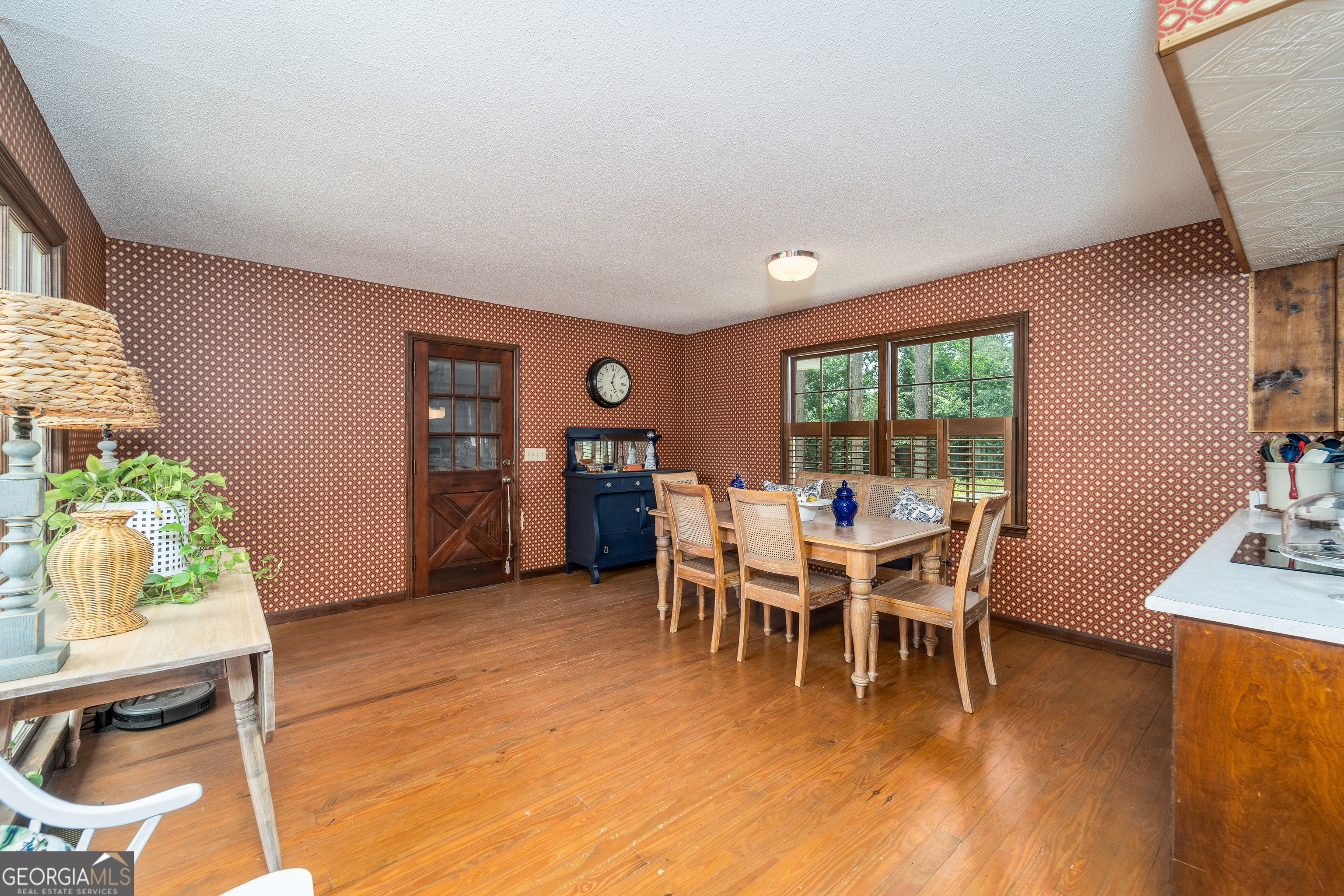 1312 Atlantic Avenue Waycross, GA 31501 - Photo 13 of 34 a dining room with furniture and wooden floor