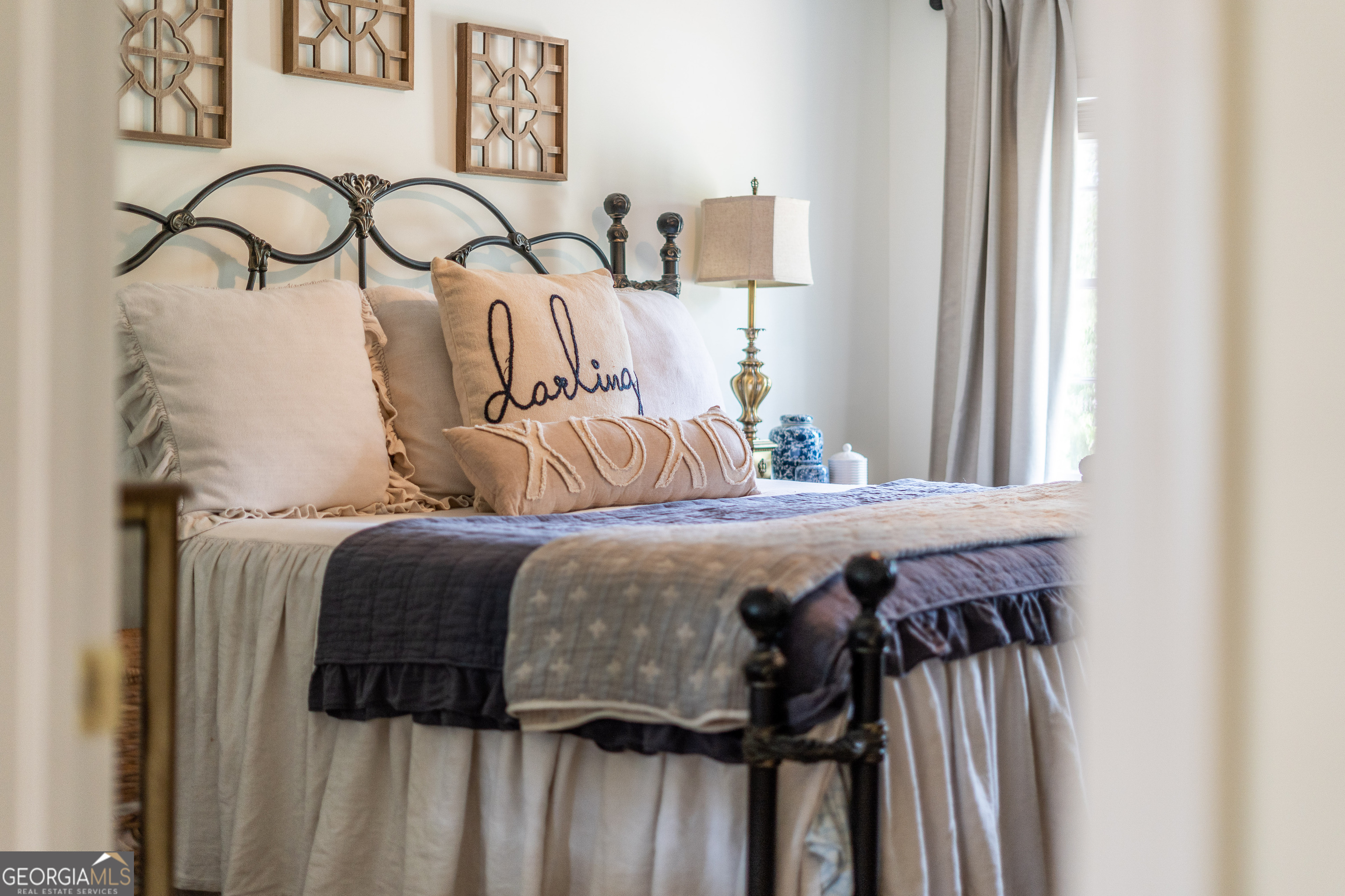 1312 Atlantic Avenue Waycross, GA 31501 - Photo 17 of 34 a bedroom with a bed and a window