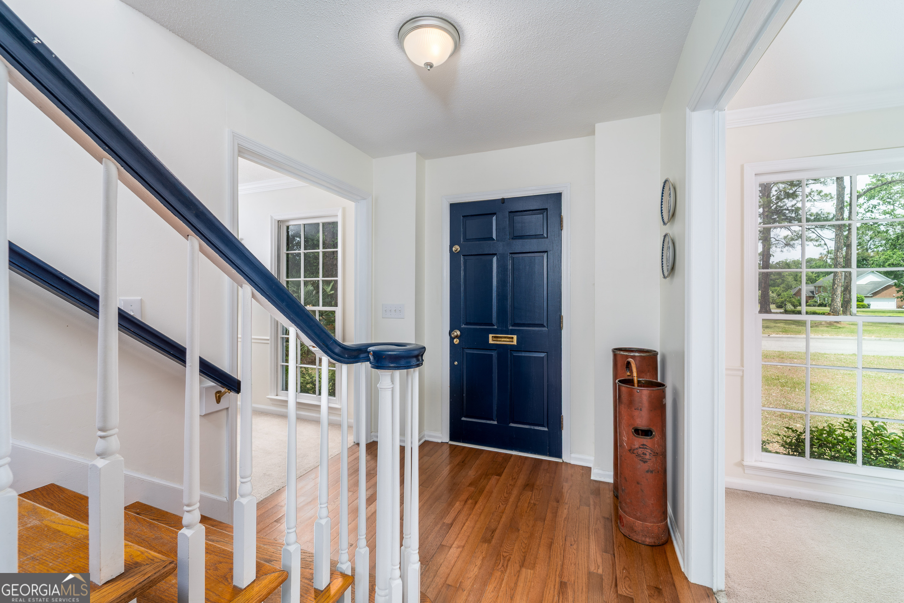 1312 Atlantic Avenue Waycross, GA 31501 - Photo 2 of 34 a view of entryway with wooden floor and stairs