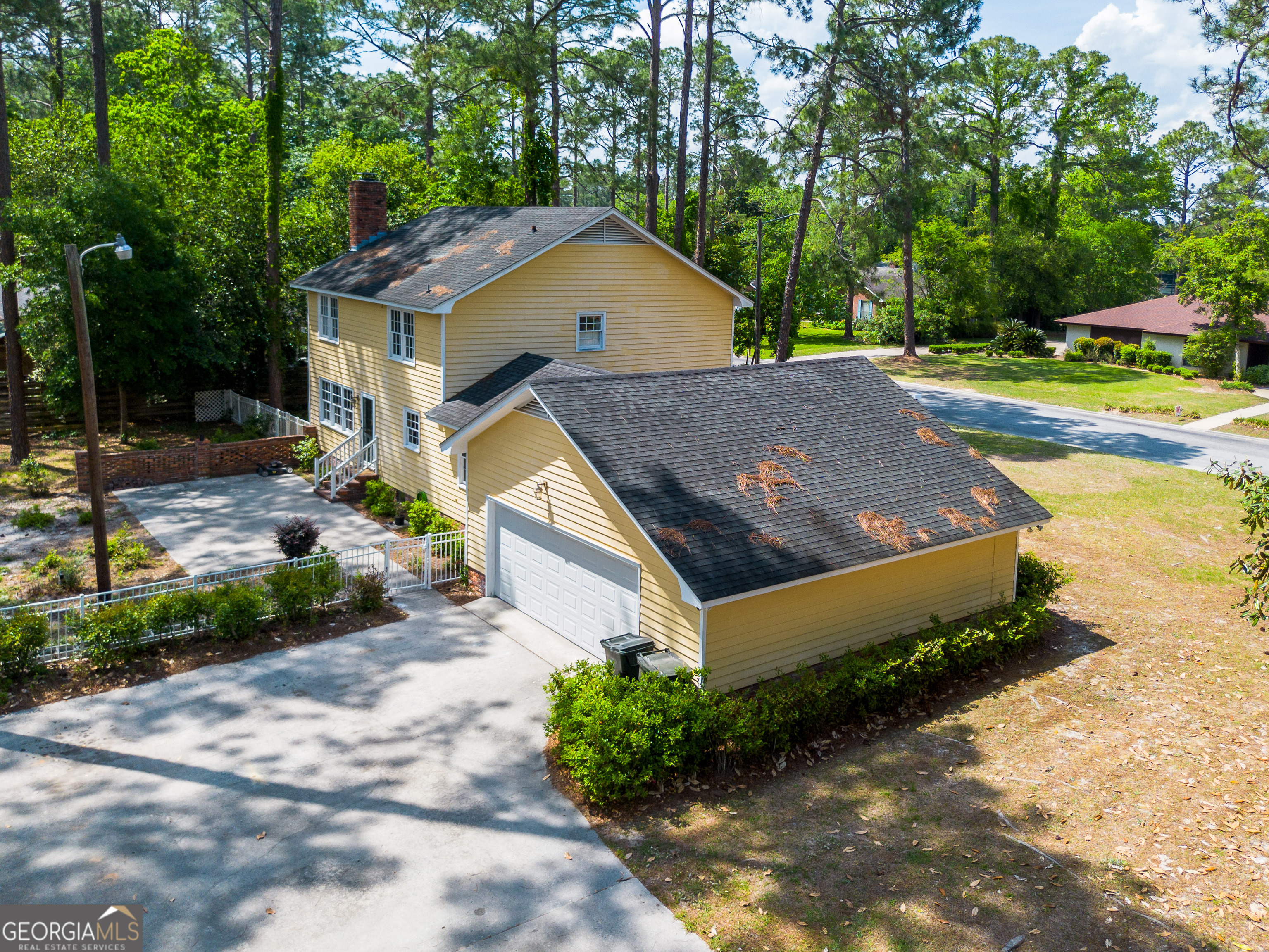 1312 Atlantic Avenue Waycross, GA 31501 - Photo 27 of 34 a house with trees in the background