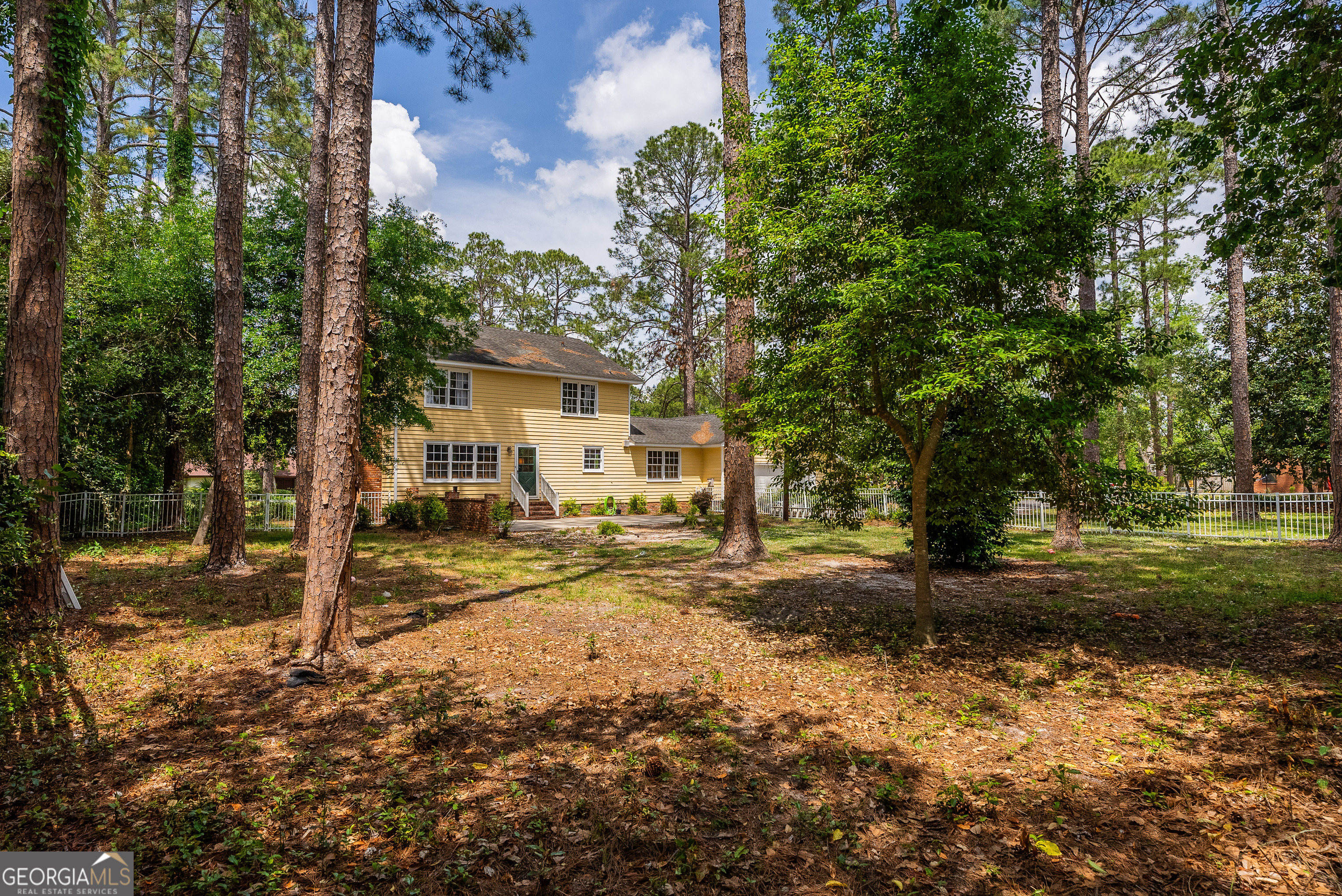 1312 Atlantic Avenue Waycross, GA 31501 - Photo 30 of 34 a view of a house with a yard