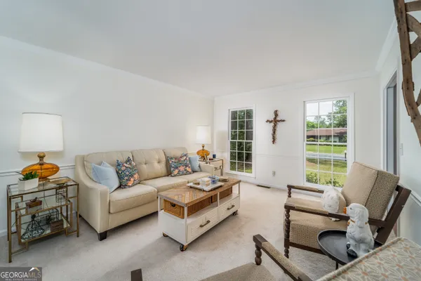 a living room with furniture and a window