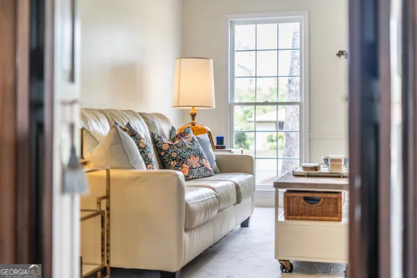 a living room with furniture and a window