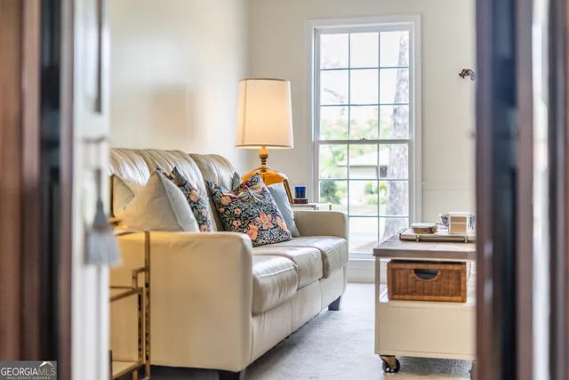 a living room with furniture and a window