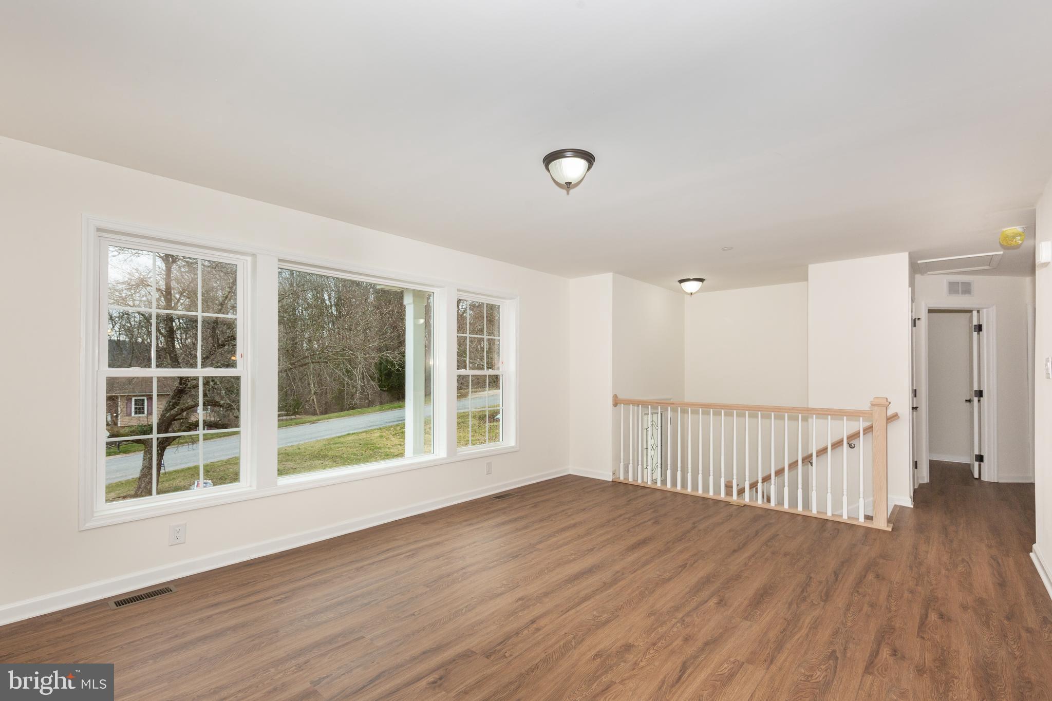 3406 Viewridge Circle Manchester, MD 21102 - Photo 18 of 57 a view of a room with wooden floor and windows