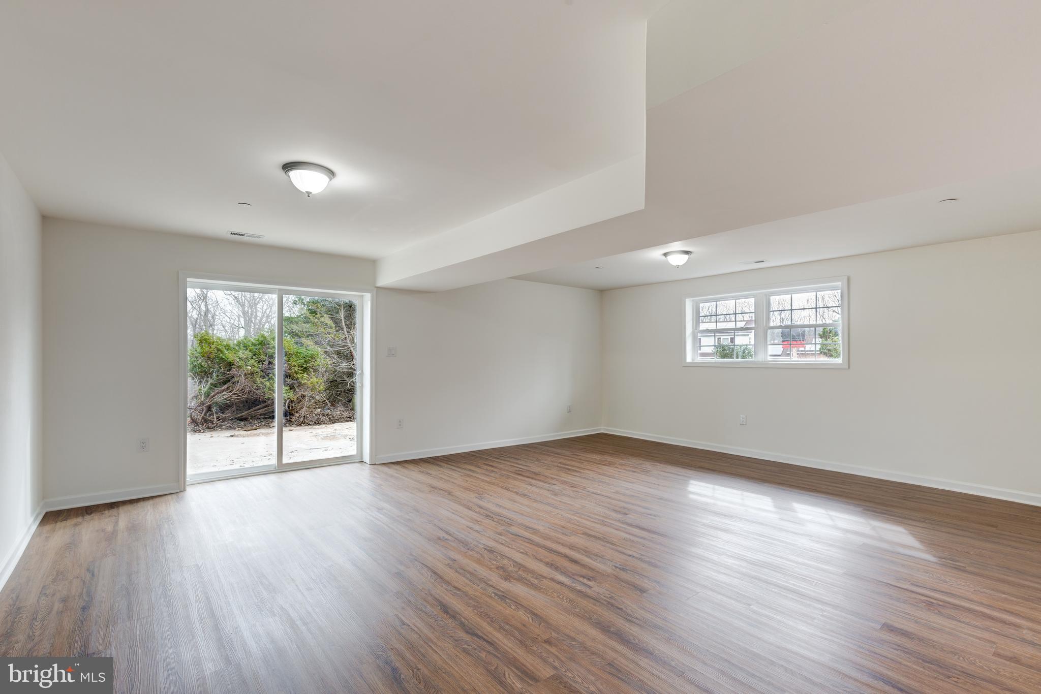 3406 Viewridge Circle Manchester, MD 21102 - Photo 21 of 57 a view of an empty room with wooden floor and a window