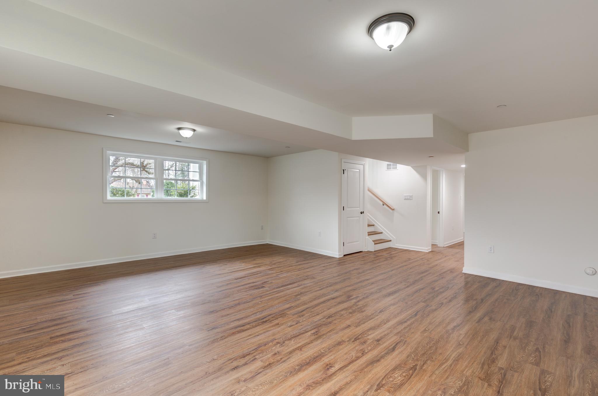 3406 Viewridge Circle Manchester, MD 21102 - Photo 35 of 57 an empty room with wooden floor and windows