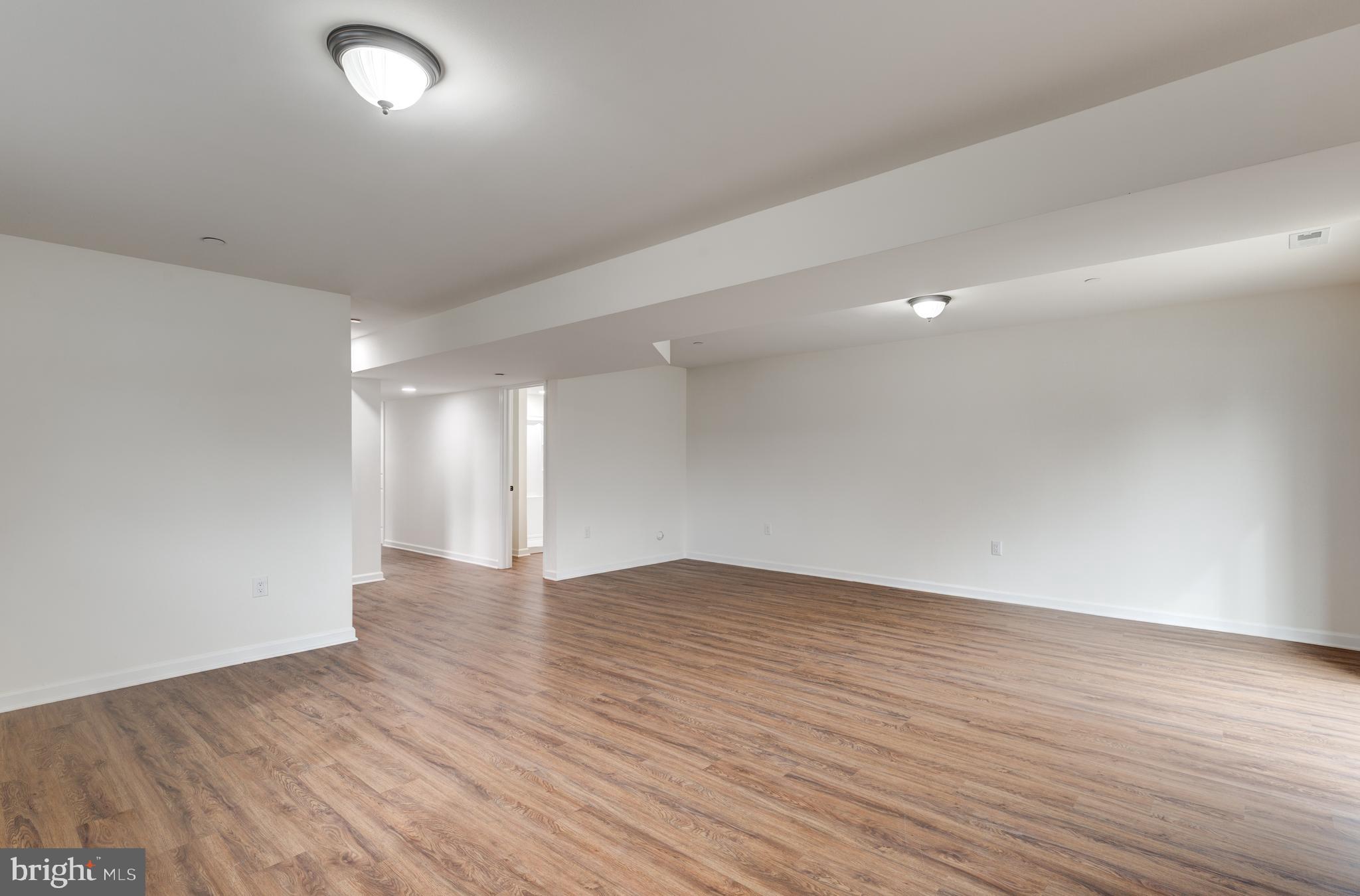 3406 Viewridge Circle Manchester, MD 21102 - Photo 36 of 57 an empty room with wooden floor and windows