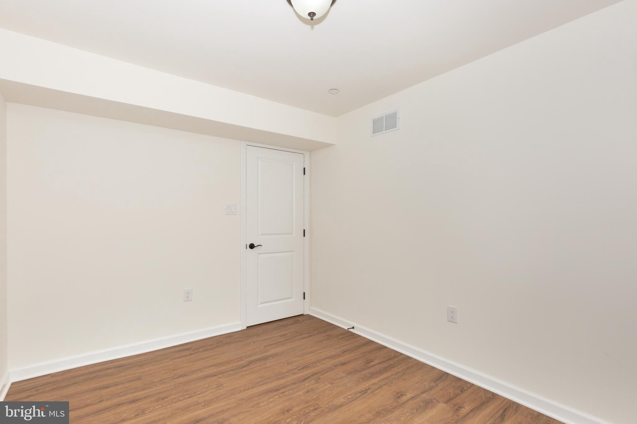 3406 Viewridge Circle Manchester, MD 21102 - Photo 41 of 57 a view of an empty room with wooden floor