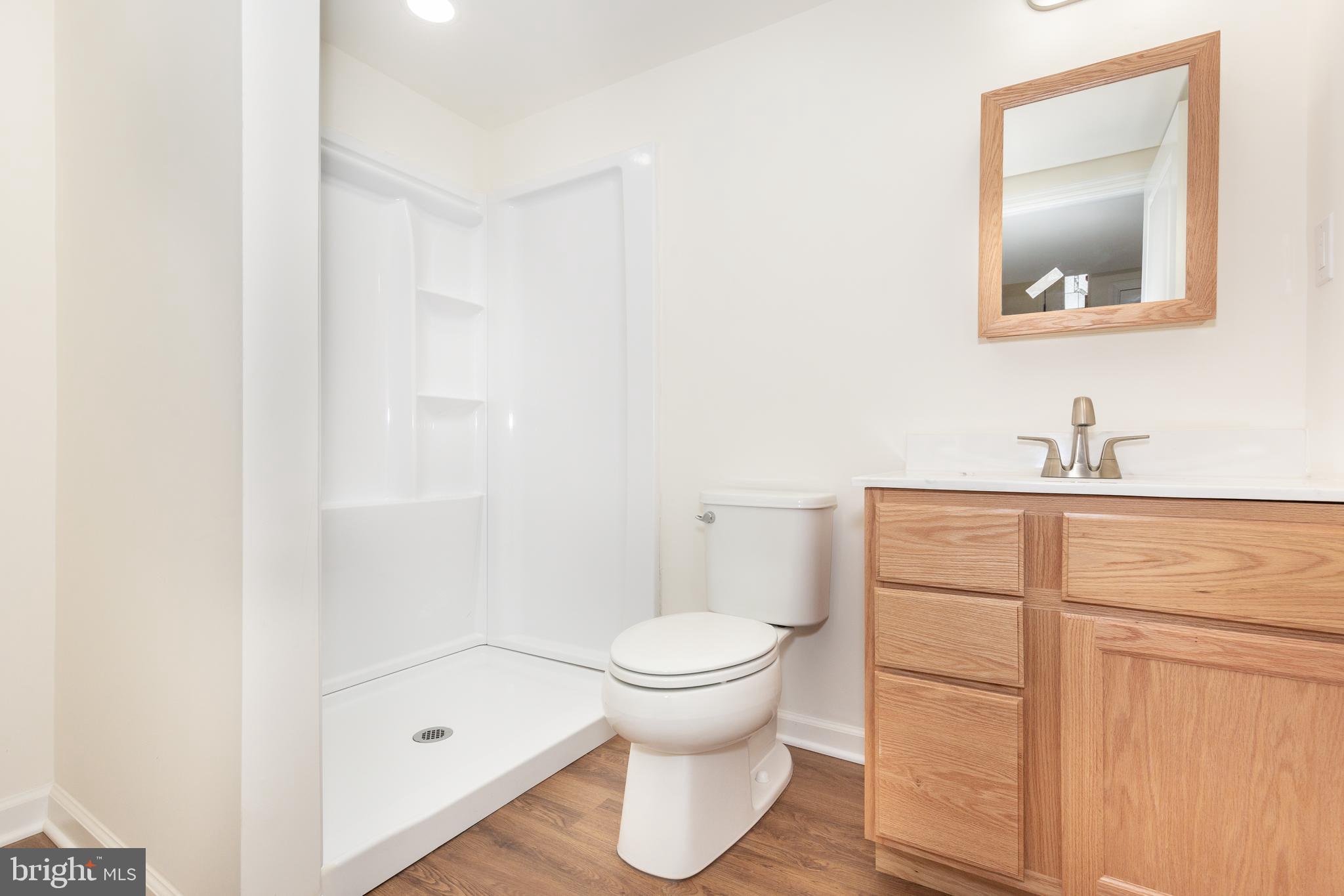 3406 Viewridge Circle Manchester, MD 21102 - Photo 42 of 57 a bathroom with a toilet sink and a mirror