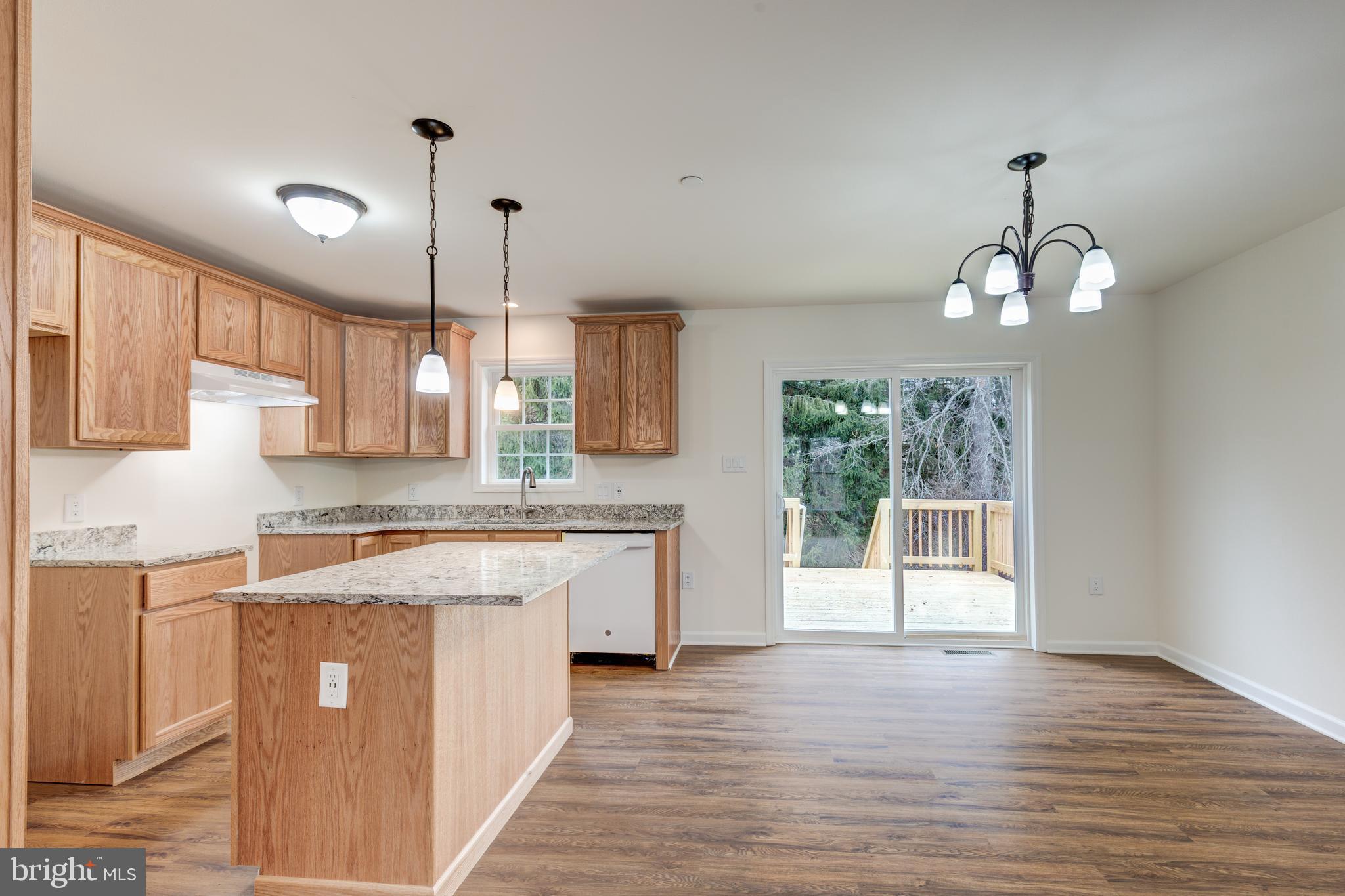 3406 Viewridge Circle Manchester, MD 21102 - Photo 9 of 57 a large kitchen with stainless steel appliances granite countertop a stove a sink dishwasher and a large refrigerator with wooden floor