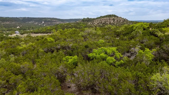 a large mirror with skyline in the background