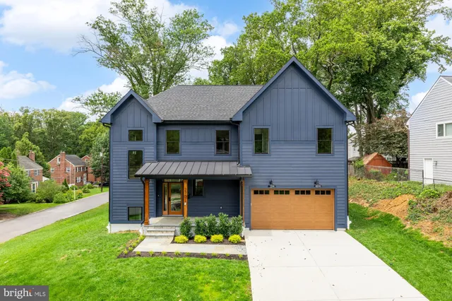 a front view of a house with a yard and porch
