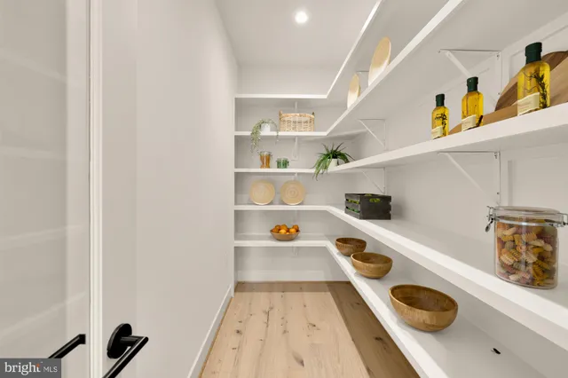 a kitchen with a sink a stove and cabinets