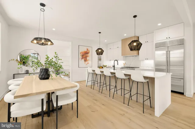 a kitchen with a table and chairs
