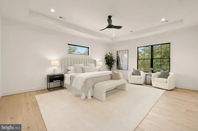 a spacious bedroom with a large bed and a couch