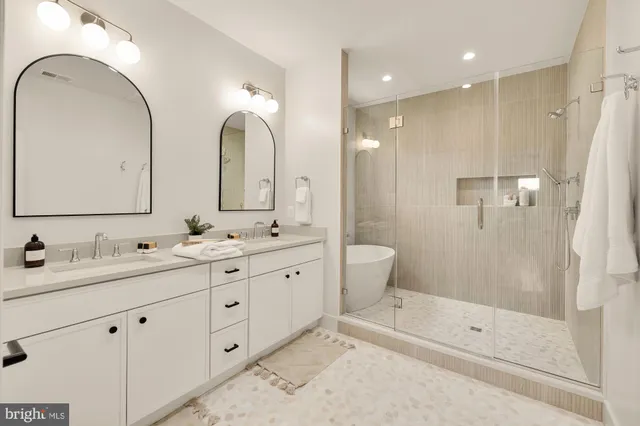 a bathroom with a bathtub and a shower