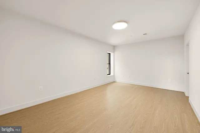 a living room with furniture and flowers