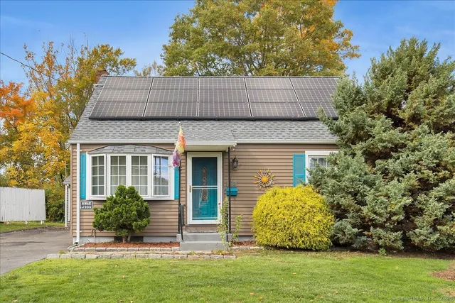 front view of a house with a garden