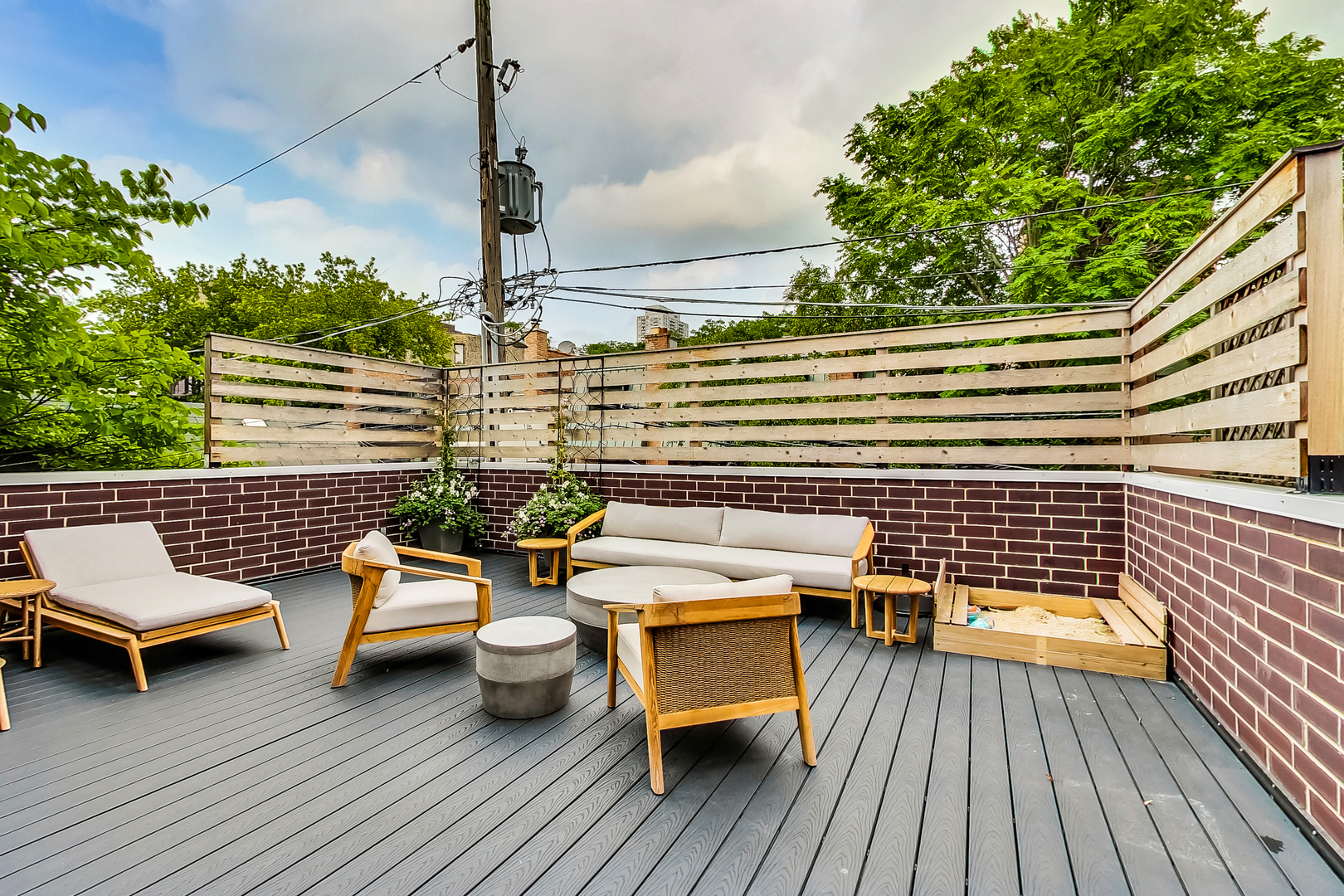 1911 North Mohawk Street, Unit 1 Chicago, IL 60614 - Photo 4 of 6 a balcony with wooden floor table and chairs