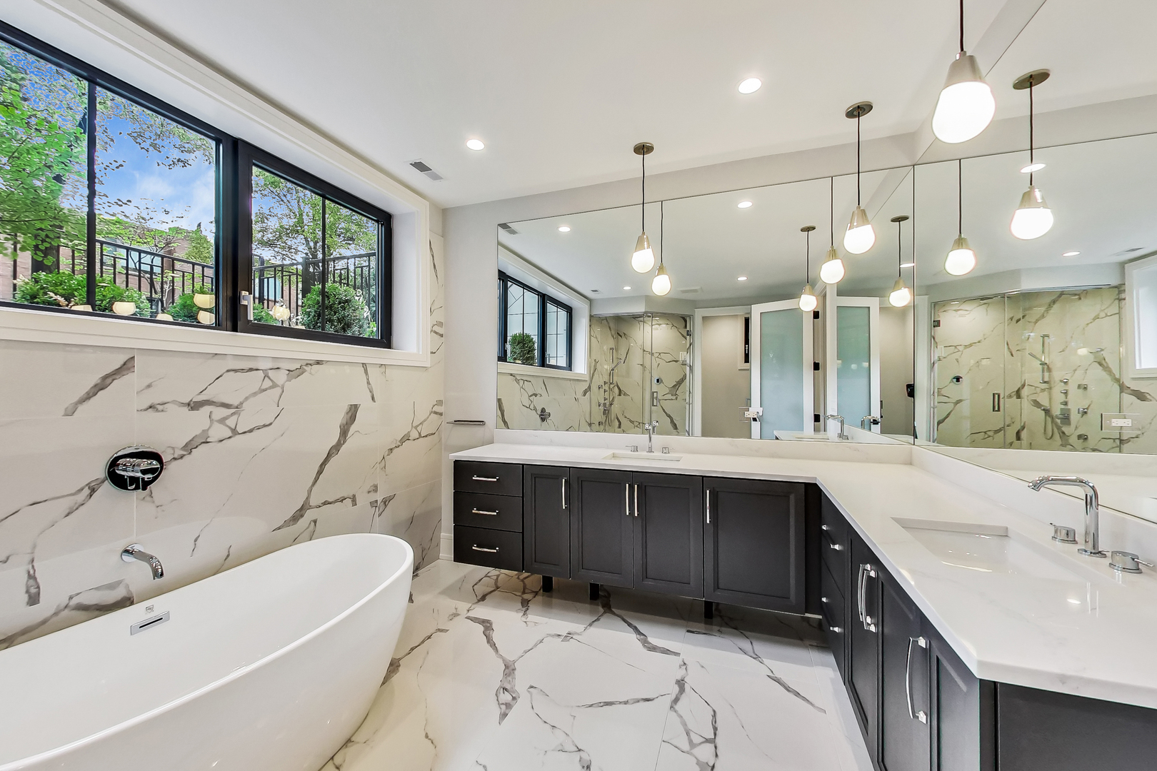 1911 North Mohawk Street, Unit 1 Chicago, IL 60614 - Photo 6 of 6 a bathroom with a large tub sink vanity granite and mirror