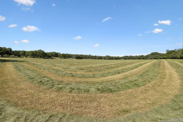 a view of an ocean beach and mountain