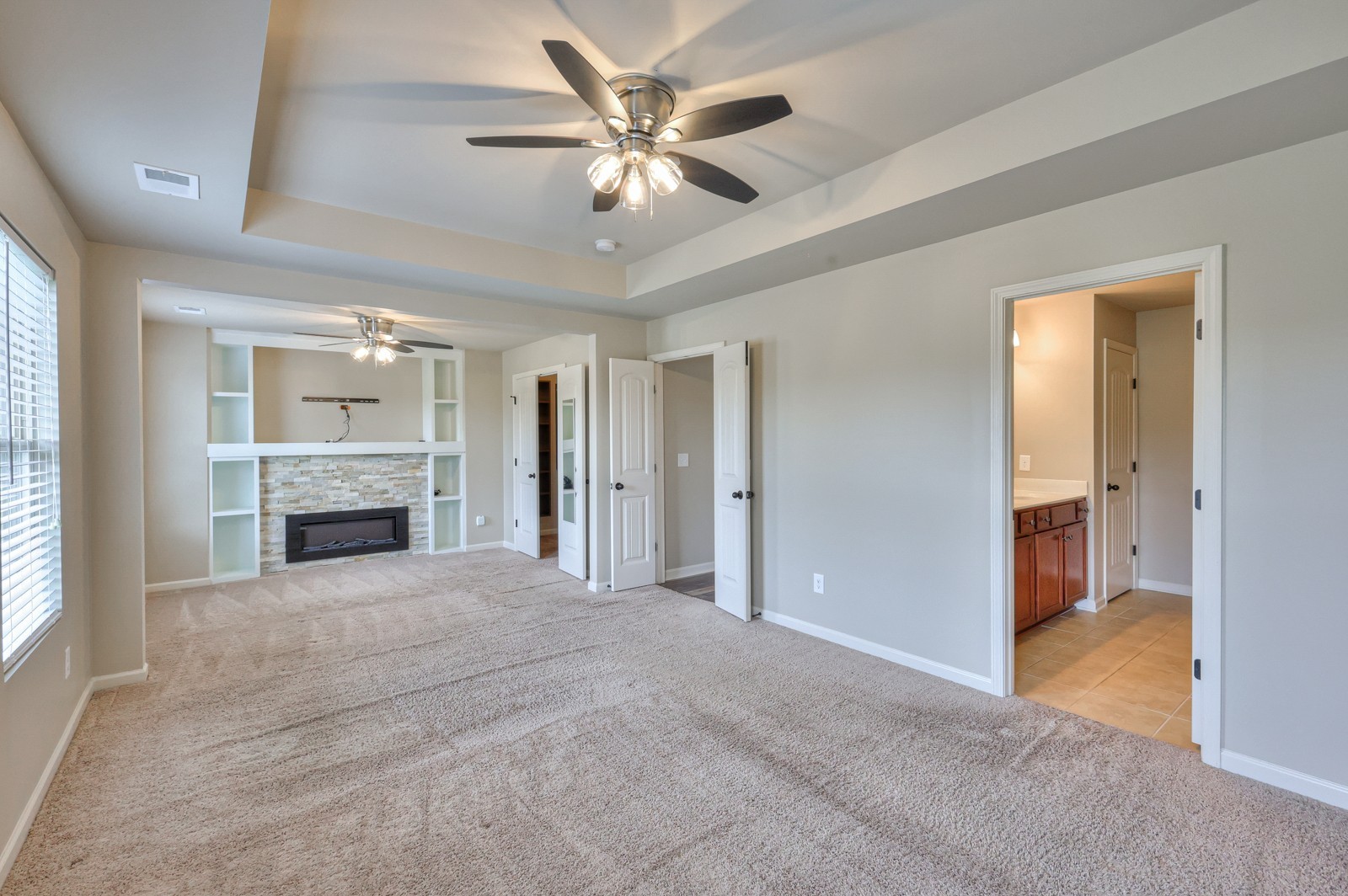 911 Brigade Loop Murfreesboro, TN 37128 - Photo 13 of 29 a view of a livingroom with a chandelier fan and a fireplace