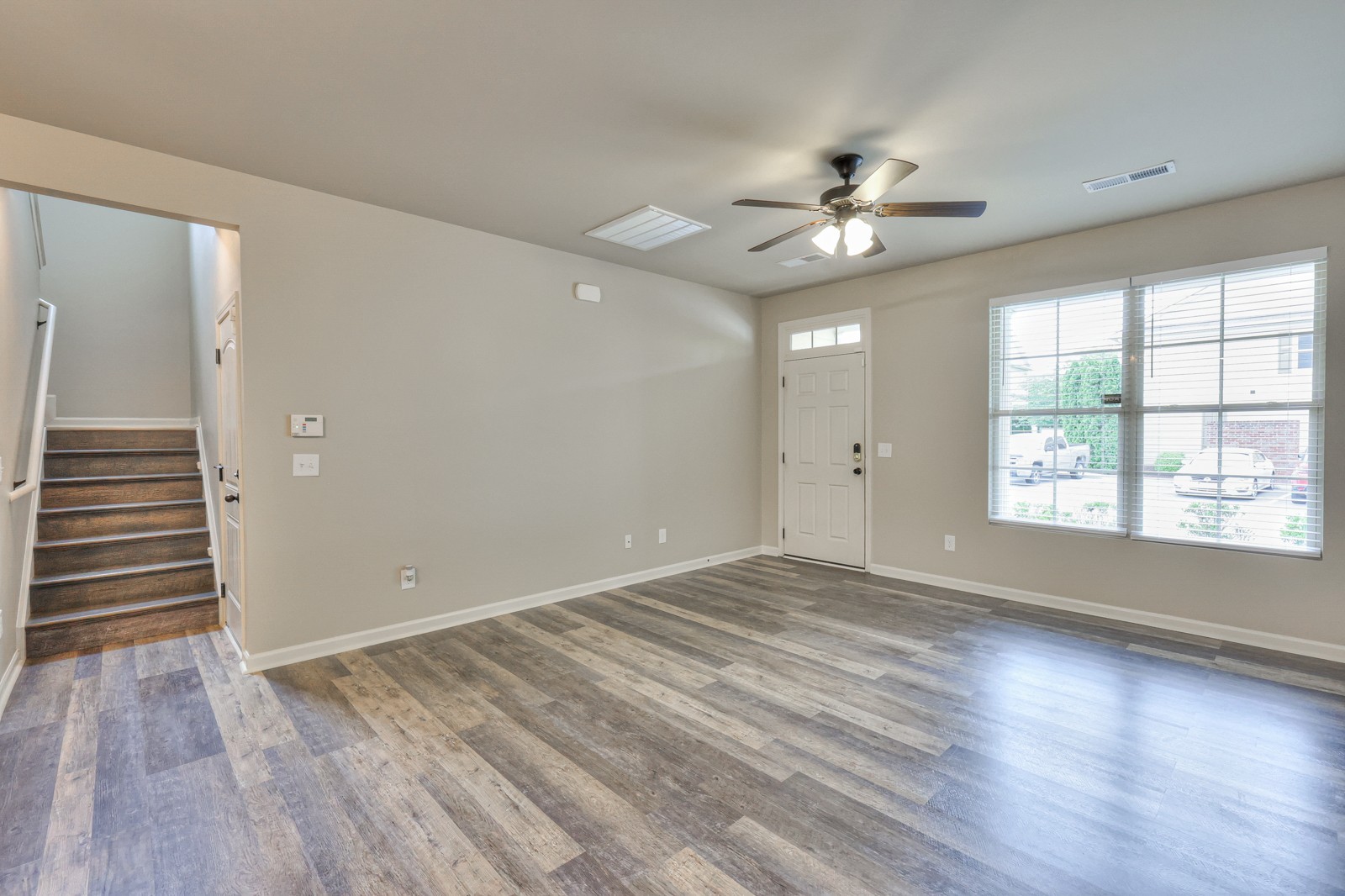 911 Brigade Loop Murfreesboro, TN 37128 - Photo 6 of 29 wooden floor in an empty room with a window