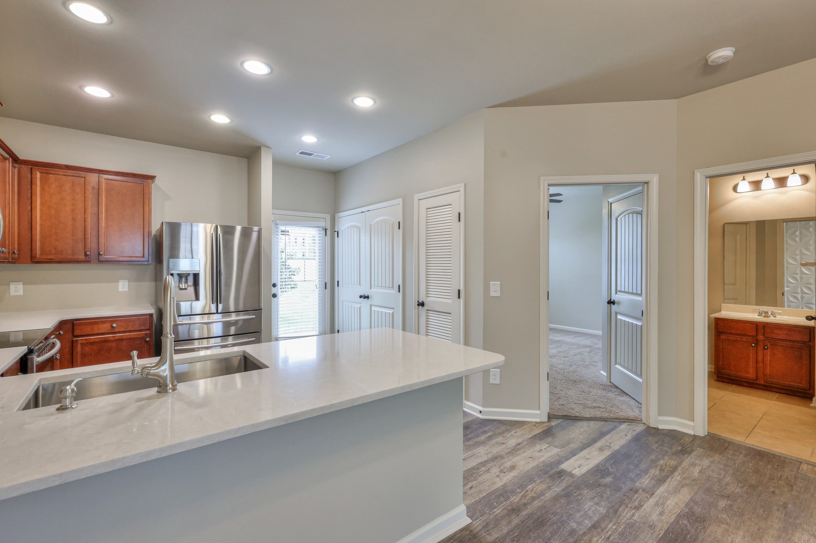 911 Brigade Loop Murfreesboro, TN 37128 - Photo 10 of 29 a kitchen with stainless steel appliances granite countertop a sink and a refrigerator